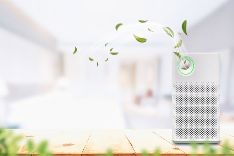 Air purifier a living room, air cleaner removing fine dust in house.
