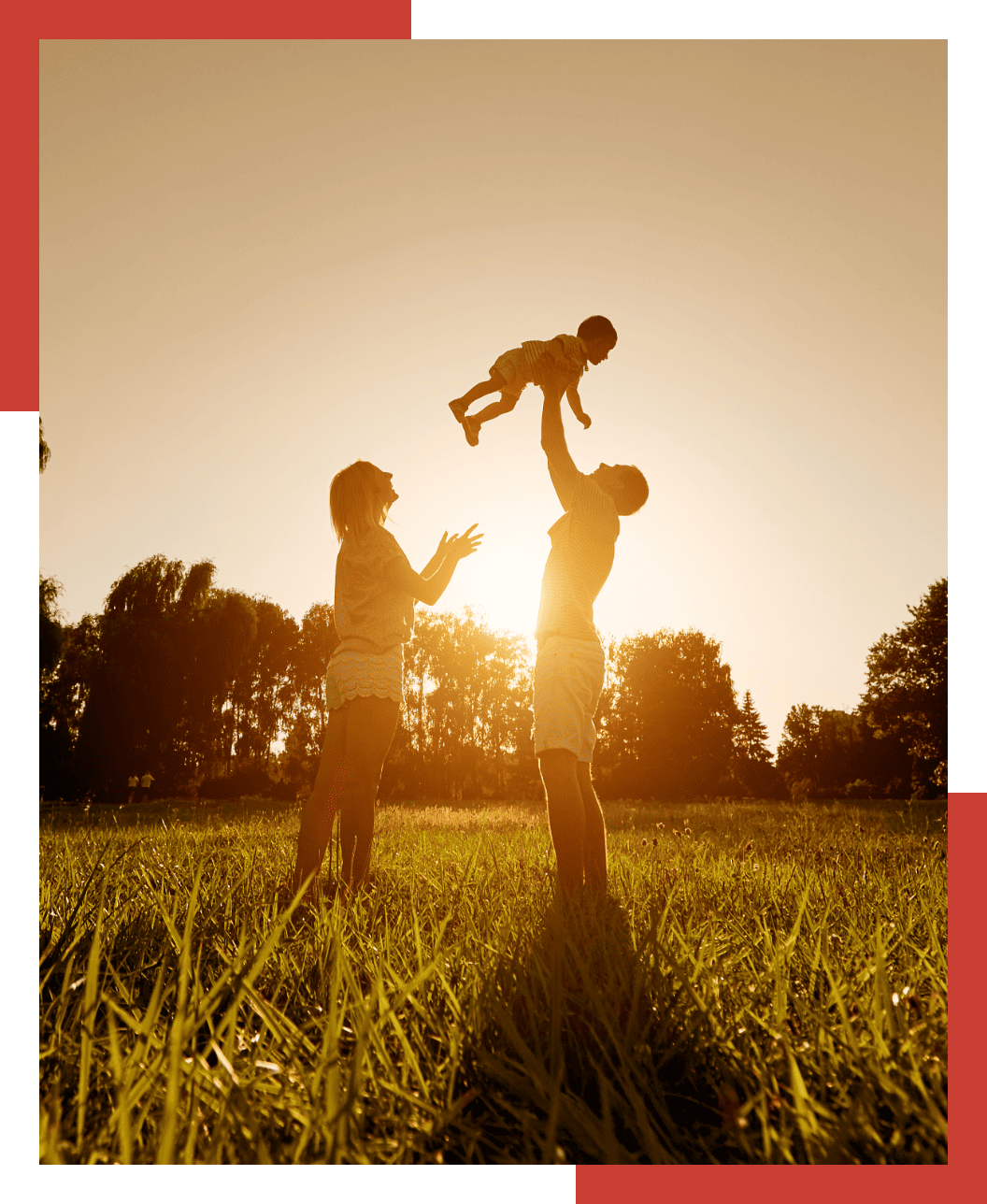 Man, woman, and child in a field.